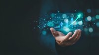 Businessman hands holding glowing digital technology icons with network connections and data visualization for modern business innovation concepts.