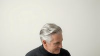 Middle-aged man with gray hair and light skin tone wearing dark clothing, isolated on white background for corporate, business, and professional design applications.