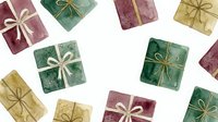 Festive gift boxes with golden ribbons in green, red and gold colors scattered on white background for holiday celebrations and Christmas decorations.