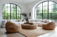 Modern bright living room with arched windows, white sectional sofa, natural rattan poufs and coffee table on jute rug. Minimalist interior design with indoor plants.