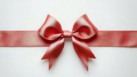 Red satin ribbon bow on white background isolated for gift wrapping, holiday decorations, greeting cards, invitations and festive design projects.