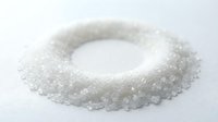 White granulated sugar arranged in a ring shape on isolated white background, ready for food and beverage design projects.