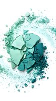 Crushed eyeshadow palette in mint green and teal shades with loose powder particles scattered on white background for cosmetics and beauty product photography.