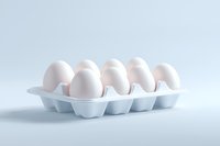 Fresh white eggs in plastic carton container on light background, minimalist food photography composition with soft shadows and clean presentation.