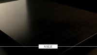 Elegant black surface with white sale banner for luxury retail marketing and promotional campaigns.