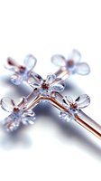 Delicate crystal flowers on copper stems create elegant composition with soft blue tones and selective focus for luxury jewelry or decorative design.