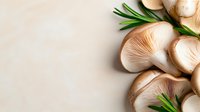 Fresh mushrooms with green rosemary sprigs arranged on neutral background, suitable for culinary, food styling, cooking blogs, and recipe content.