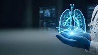 Doctor holding glowing holographic lungs in medical technology concept for respiratory health diagnosis and pulmonary care innovation.