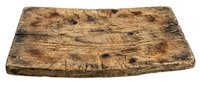 Weathered wooden cutting board with natural grain texture and aged patina, suitable for rustic kitchen decor, food styling, and culinary photography.