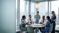 Diverse medical team of doctors and nurses having meeting in modern hospital conference room with city skyline view discussing patient care strategies.