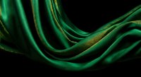 Luxurious emerald green silk fabric with golden highlights flowing in elegant waves against dark background for premium design projects.