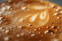 Macro shot of water droplets on golden brown surface with soft bokeh effect and shallow depth of field creating abstract texture pattern. Suitable for backgrounds.