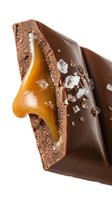 Broken chocolate bar with caramel filling and sea salt crystals on white background, isolated for confectionery packaging, advertising, and food styling projects.