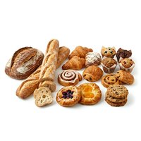 Assorted fresh baked goods including artisan bread, croissants, pastries, muffins and cookies isolated on white background for bakery and food design use.