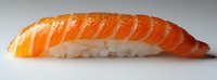 Fresh salmon nigiri sushi piece with tender raw fish layered over pressed white rice on neutral background, showcasing traditional Japanese culinary artistry.
