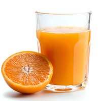 Fresh squeezed orange juice in clear glass with half cut ripe orange on white background, bright natural citrus drink for healthy breakfast.