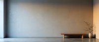 Minimalist interior with empty concrete floor, neutral beige wall, wooden bench, and dried plant decoration. Suitable for modern design, architecture, and home decor projects.
