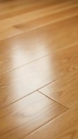 Natural oak hardwood flooring planks with warm honey tones and visible wood grain texture for interior design and home renovation projects.