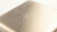 Open book with soft golden lighting and shallow depth of field creating warm atmospheric reading environment for literature and education concepts.