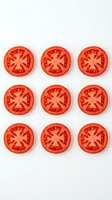 Nine fresh tomato slices arranged in a grid pattern on white background, showing vibrant red flesh and seeds. Isolated produce for culinary, food styling, and recipe design use.