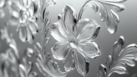 Elegant floral pattern with metallic silver flowers and ornate leaves in relief style creates luxurious dimensional effect for decorative backgrounds and design elements.