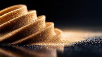 Glowing golden waves of fine particles creating abstract macro pattern with light reflections on dark background, artistic composition for luxury designs.