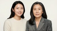 Asian mother and adult daughter portrait showing family bond and generational connection in professional studio setting.