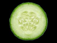 Cucumber slice cross-section isolated on transparent background, ready for culinary design, food packaging, recipe graphics, t-shirt prints, stickers, and print-on-demand products.