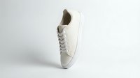 White leather sneaker floating on light background, showcasing minimalist casual footwear design for fashion, retail, and advertising use.