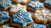 Festive star-shaped sugar cookies decorated with blue icing and white snowflake patterns. Holiday baking treats arranged on dark surface with sparkly sugar crystals.