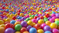 Colorful candy balls scattered across surface creating vibrant rainbow pattern. Multicolored spherical sweets in bright hues for confectionery and celebration themes.