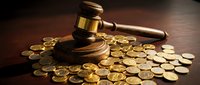 Wooden judge gavel surrounded by golden coins on dark surface representing legal fees, financial litigation, court costs, and justice system expenses.