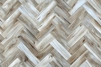 Herringbone pattern wooden floor in light beige and white tones creates geometric layout. Natural oak parquet flooring with distinctive grain texture.