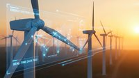 Wind turbines at sunset with digital data overlay showing renewable energy analytics and real-time monitoring systems for sustainable power generation.