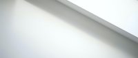 Minimalist white ceiling corner with soft natural light casting subtle shadow, creating clean architectural detail for modern interior design projects.