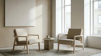 Modern minimalist living room interior with two beige armchairs and wooden side table in natural sunlight for contemporary home decor and furniture design.