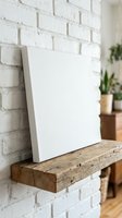 Blank white canvas on rustic wooden shelf against white brick wall with plants in background for art mockup and home decor presentation.