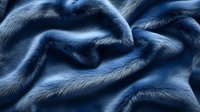 Luxurious navy blue faux fur fabric with soft waves and folds creating elegant texture. Close up macro photography shows detailed fibers and plush material surface.