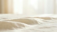 Soft beige linen fabric with natural texture and gentle folds, ideal for home decor, textile design, and interior styling projects.