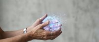 Hands holding glowing digital globe with network connections and sparkles representing global technology, innovation, and futuristic communication concepts.