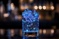 Glowing blue cocktail with crushed ice in rocks glass against dark bar background, illuminated by neon lights creating magical sparkle effect. Perfect for beverage menu design.