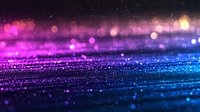 Magical glitter background with pink and blue gradient colors, sparkling bokeh lights and defocused particles creating dreamy abstract surface texture.