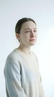 Young Caucasian woman with emotional expression wearing cream knit sweater against white background for mental health awareness campaigns.