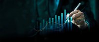 Business professional analyzing financial growth data with digital charts and graphs showing upward trends for investment strategy presentations.
