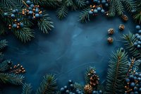 Festive winter frame with blue ornaments, pine cones and fir branches on dark blue textured background. Natural holiday border design for seasonal cards.
