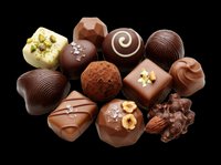 Assorted chocolate truffles and bonbons isolated on transparent background, ready for use on packaging, menus, food blogs, print-on-demand products, and culinary designs.