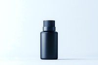Minimalist matte black cosmetic bottle on light background, premium packaging mockup for skincare, fragrance or beauty product presentation.