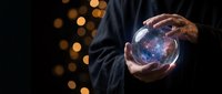 Businessman hands holding glowing cosmic sphere with stars and nebula against bokeh lights background for technology and innovation concepts.