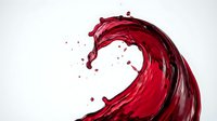 Dynamic red liquid splash creating elegant curved wave motion with droplets against white background for creative design projects.
