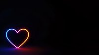 Glowing neon heart with blue and pink gradient light effect on dark background for romantic designs and Valentine's Day projects.
